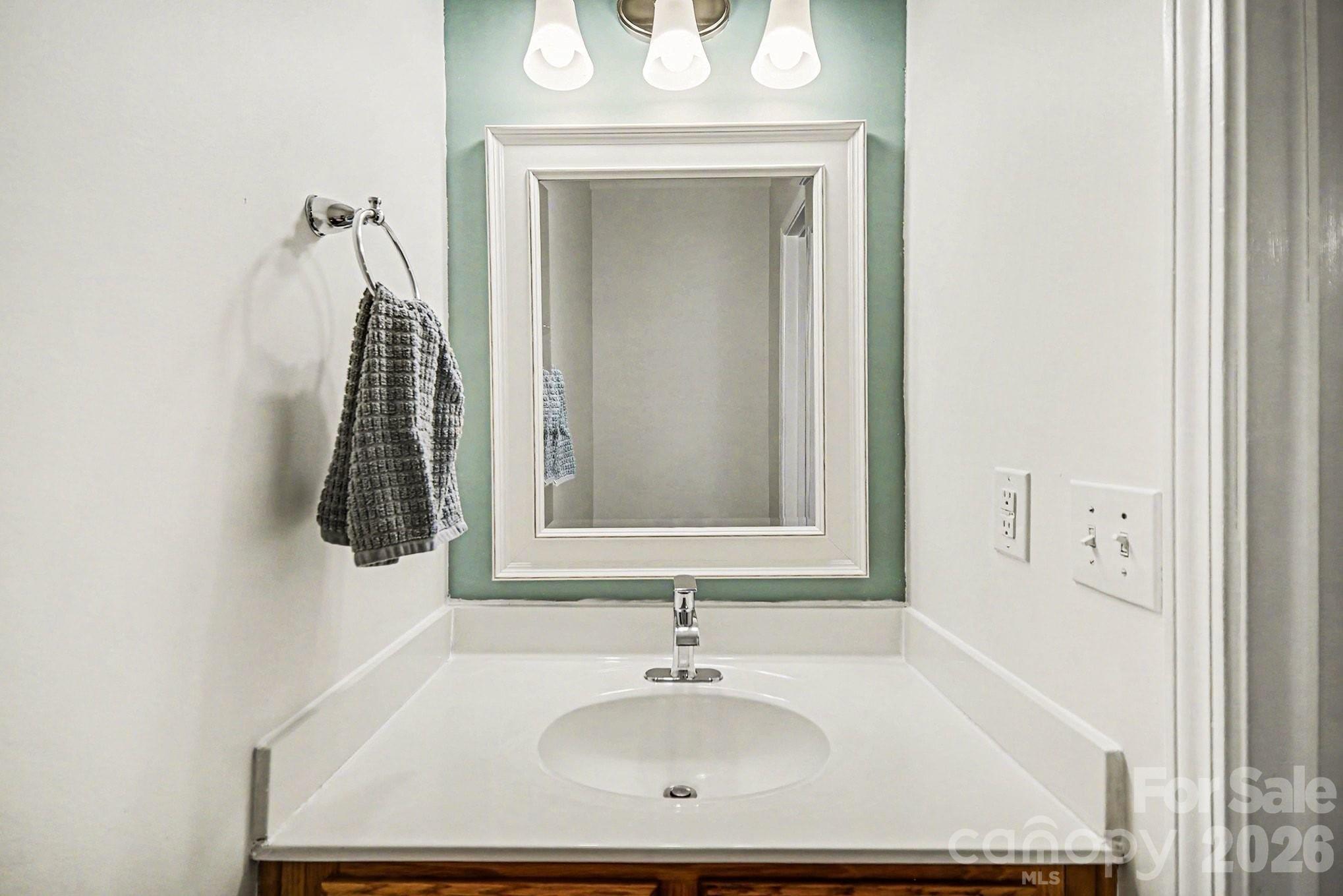 8048 Stoneham Court Matthews, NC 28105 - Photo 6 of 15 a bathroom with a sink and a mirror