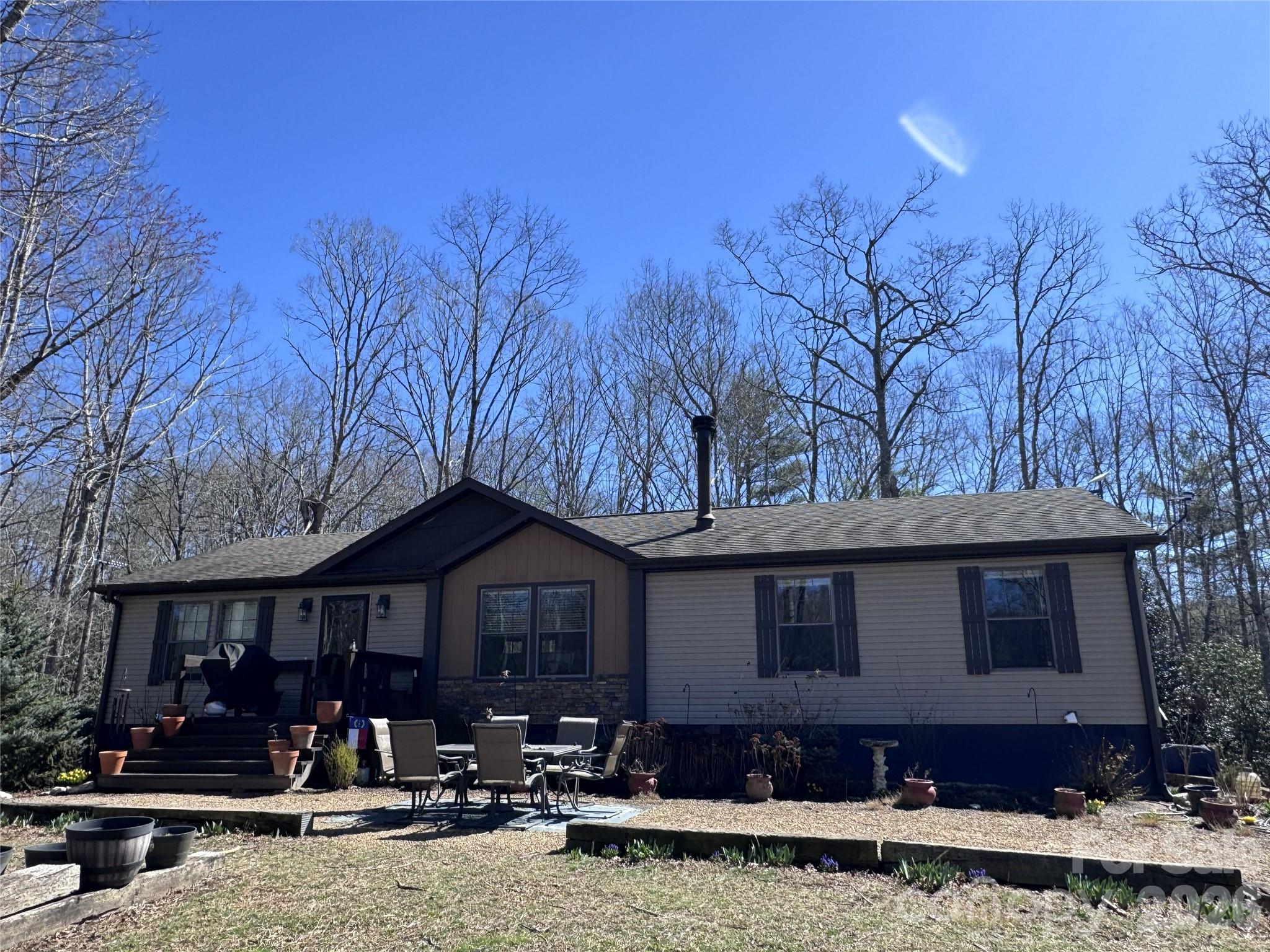 a front view of a house with yard porch and livingroom