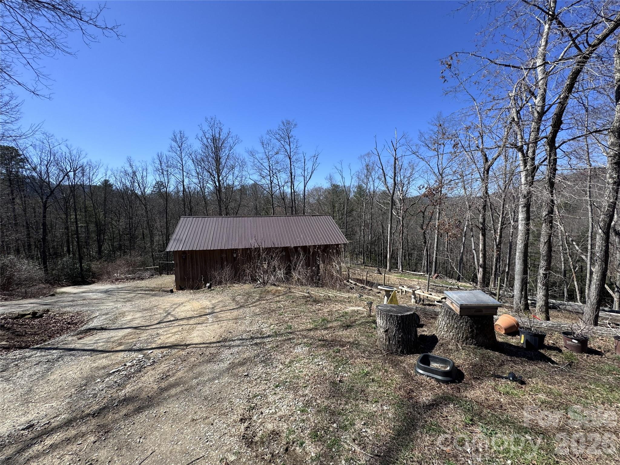 119 Walkabout Trail Fletcher, NC 28732 - Photo 3 of 3 a backyard of a house with table and chairs