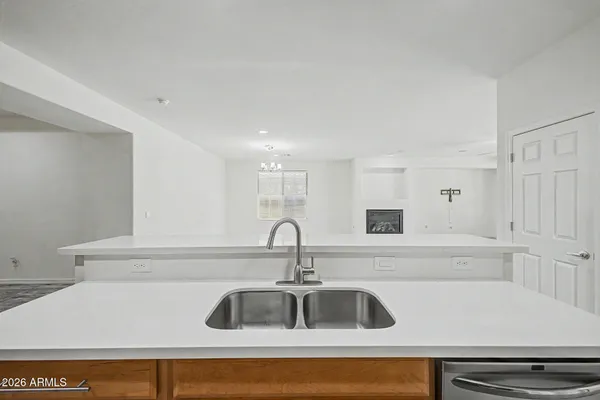 a kitchen with a sink and cabinets