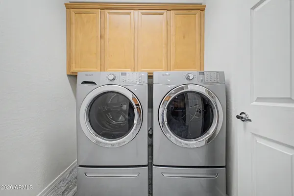 a utility room with dryer and washer
