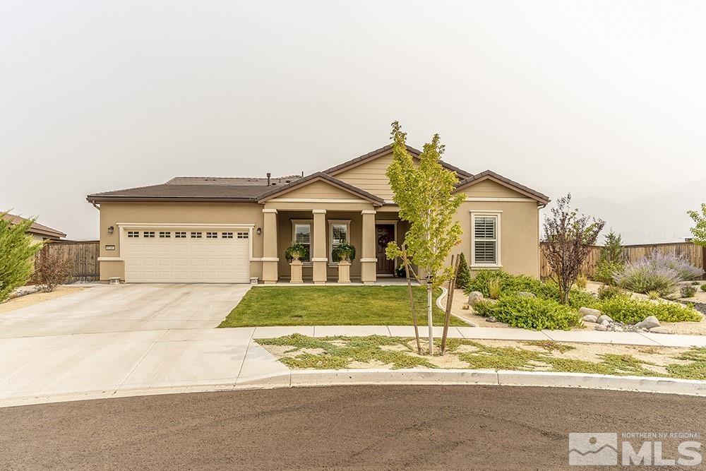 9266 Maplehurst Trail Reno, NV 89523 - Photo 1 of 29 a view of a house with a yard and garage