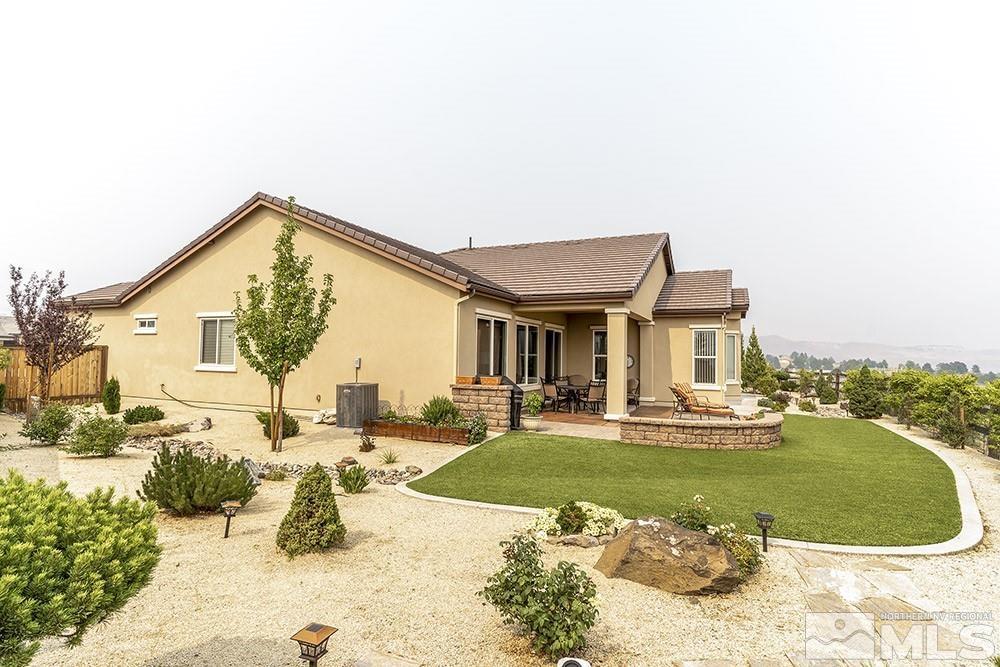 9266 Maplehurst Trail Reno, NV 89523 - Photo 14 of 29 a view of a house with a swimming pool