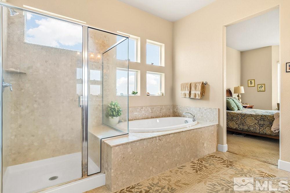 9266 Maplehurst Trail Reno, NV 89523 - Photo 25 of 29 a spacious bathroom with a tub shower and sink
