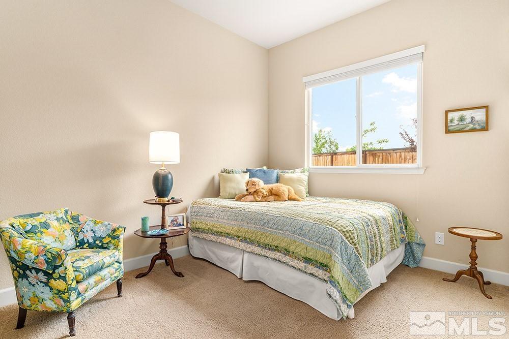 9266 Maplehurst Trail Reno, NV 89523 - Photo 28 of 29 a bedroom with a bed and a couch