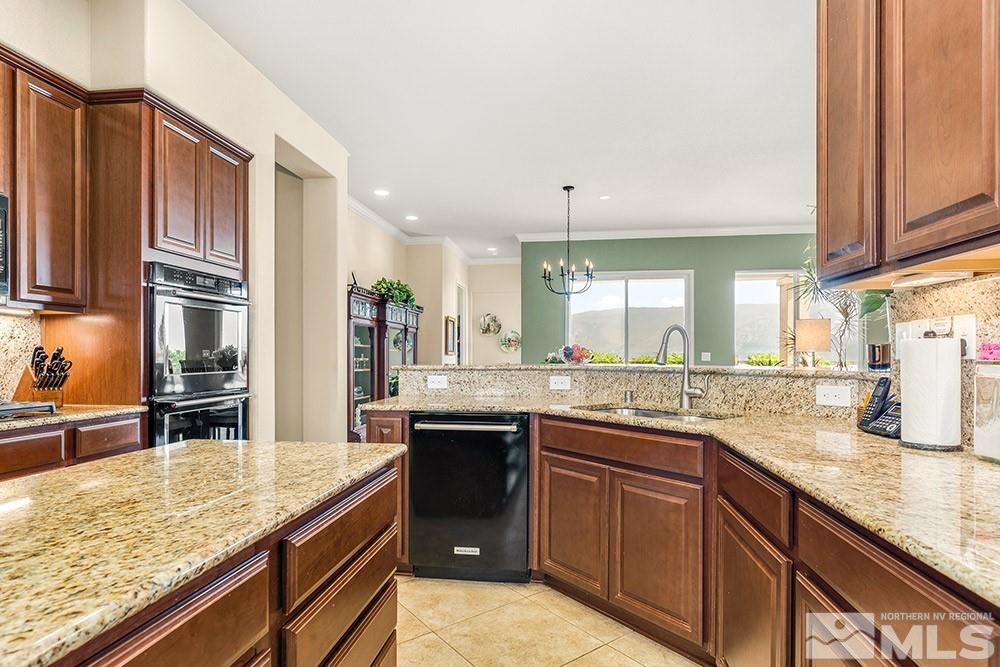 9266 Maplehurst Trail Reno, NV 89523 - Photo 3 of 29 a kitchen with stainless steel appliances granite countertop counter space a sink and cabinets