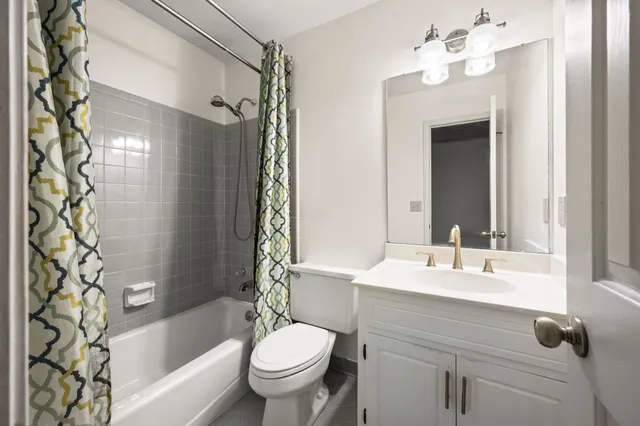 a bathroom with a sink toilet a bathtub and shower