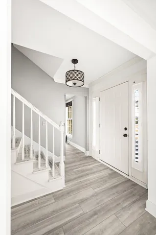 a view of entryway with wooden floor