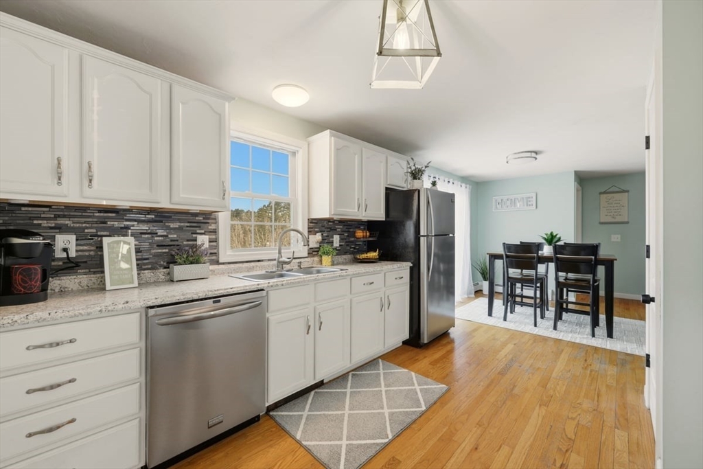 19 Station Street Wareham, MA 02571 - Photo 16 of 41 a kitchen with granite countertop a refrigerator stove top oven and sink