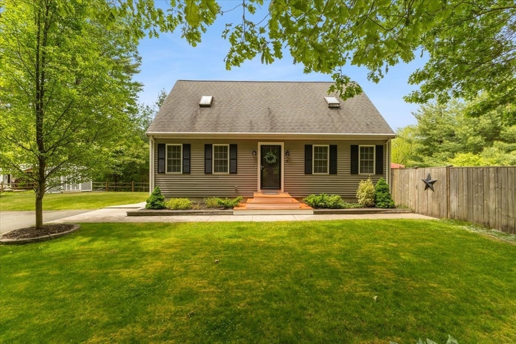19 Station Street Wareham, MA 02571 - Photo 2 of 41 a front view of a house with yard and green space