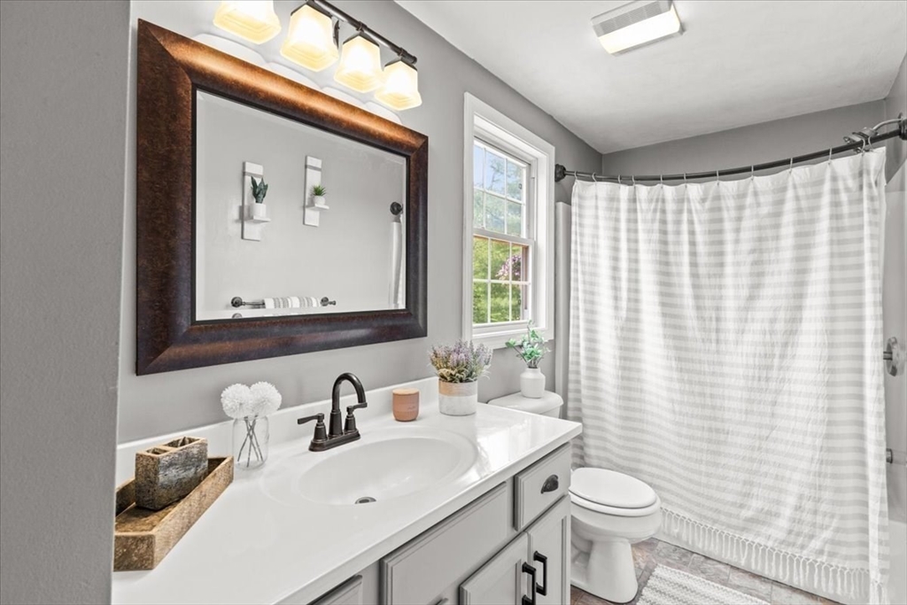 19 Station Street Wareham, MA 02571 - Photo 23 of 41 a bathroom with a toilet sink and mirror