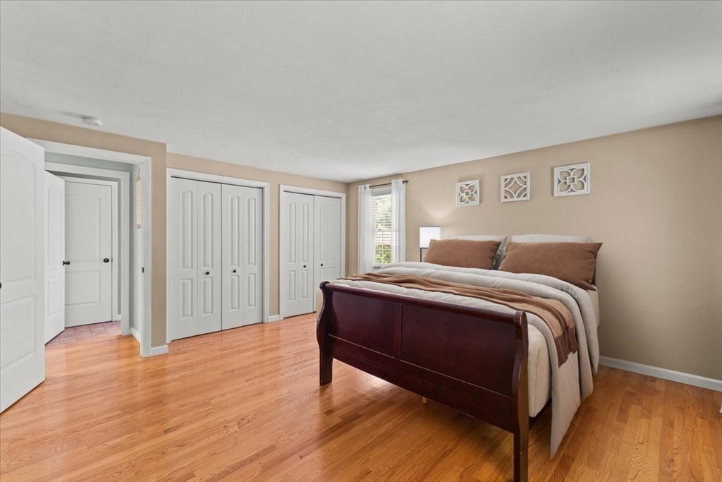 19 Station Street Wareham, MA 02571 - Photo 27 of 41 a bedroom with a bed and wooden floor