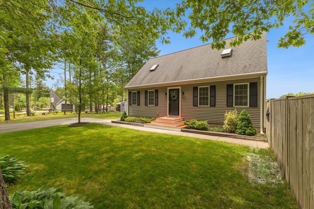 19 Station Street Wareham, MA 02571 - Photo 3 of 41 a front view of a house with a yard