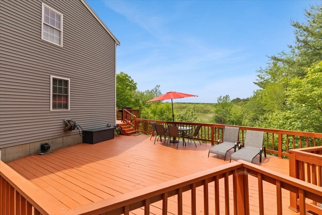 19 Station Street Wareham, MA 02571 - Photo 4 of 41 a view of a chairs and table on the deck