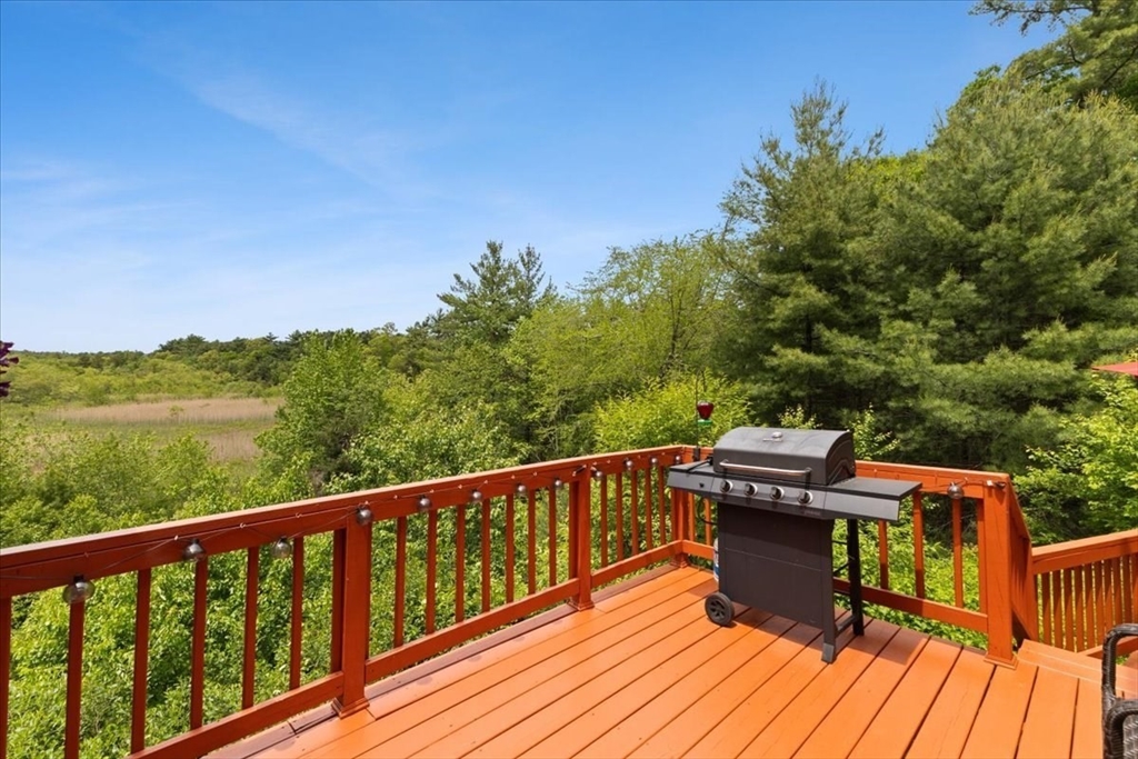 19 Station Street Wareham, MA 02571 - Photo 5 of 41 a view of a balcony with wooden floor and outdoor seating