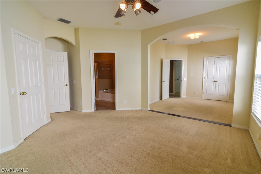 8960 Falcon Pointe Loop Fort Myers, FL 33912 - Photo 14 of 25 a view of a livingroom with a chandelier fan