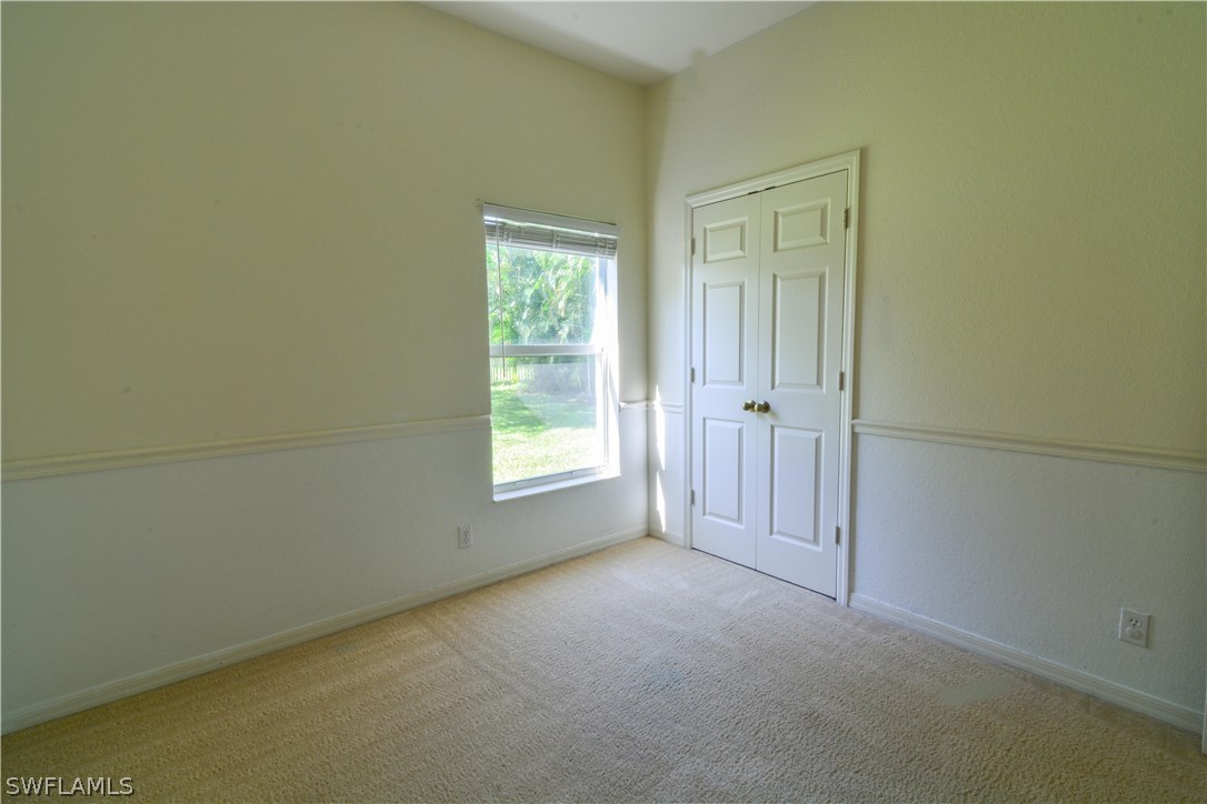 8960 Falcon Pointe Loop Fort Myers, FL 33912 - Photo 18 of 25 an empty room with a window