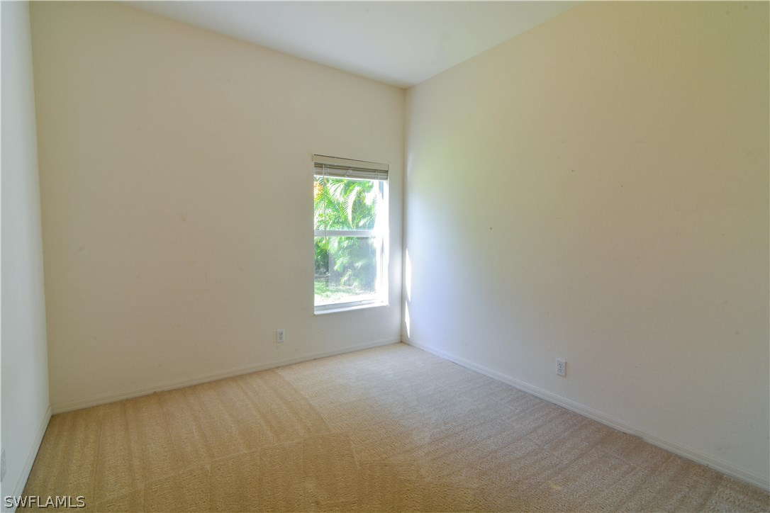 8960 Falcon Pointe Loop Fort Myers, FL 33912 - Photo 20 of 25 a view of an empty room with a window