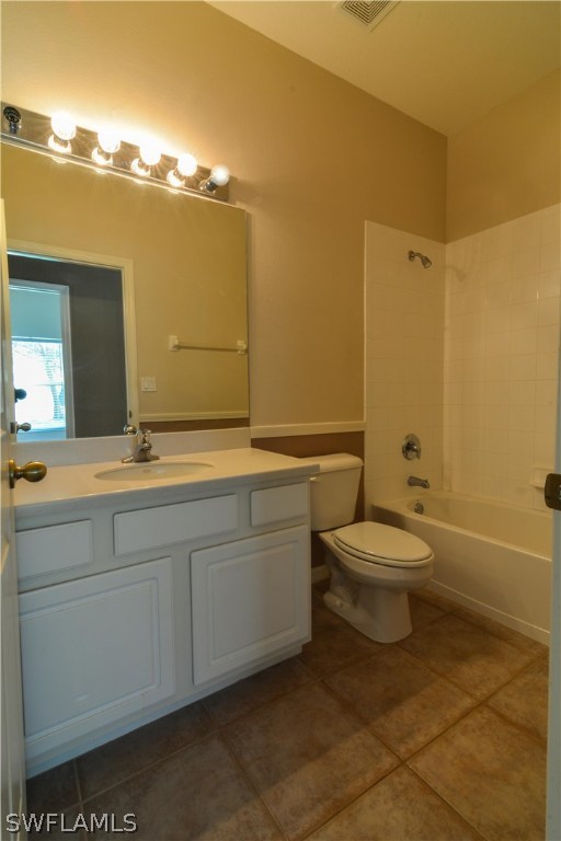 8960 Falcon Pointe Loop Fort Myers, FL 33912 - Photo 21 of 25 a bathroom with a toilet a sink and mirror