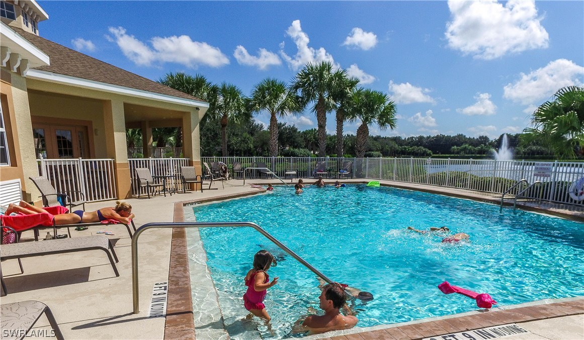 8960 Falcon Pointe Loop Fort Myers, FL 33912 - Photo 23 of 25 a view of a swimming pool with a patio