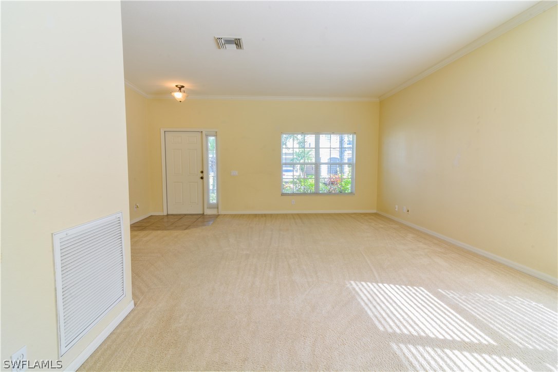 8960 Falcon Pointe Loop Fort Myers, FL 33912 - Photo 6 of 25 a view of an empty room with a window