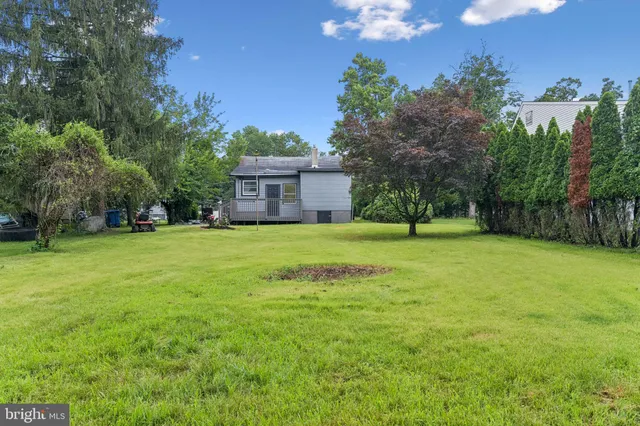 a view of a house with a big yard