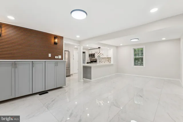 a view of a kitchen with a sink and cabinets