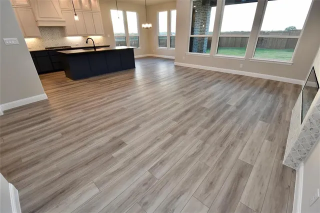a view of a living room with a large window