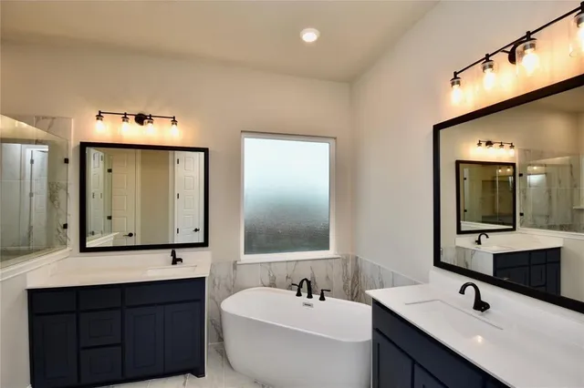 a white bath tub sitting in a bathroom