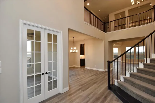 a view of entryway with wooden floor and stairs
