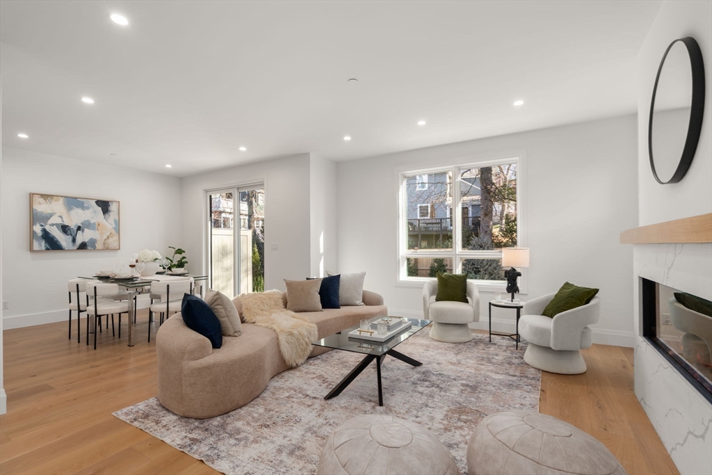 956 Walnut Street, Unit 5 Newton, MA 02459 - Photo 13 of 38 a living room with furniture and a window