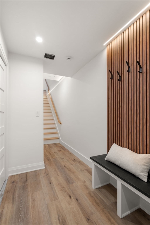 956 Walnut Street, Unit 5 Newton, MA 02459 - Photo 33 of 38 a view of entryway with stairs and wooden floor