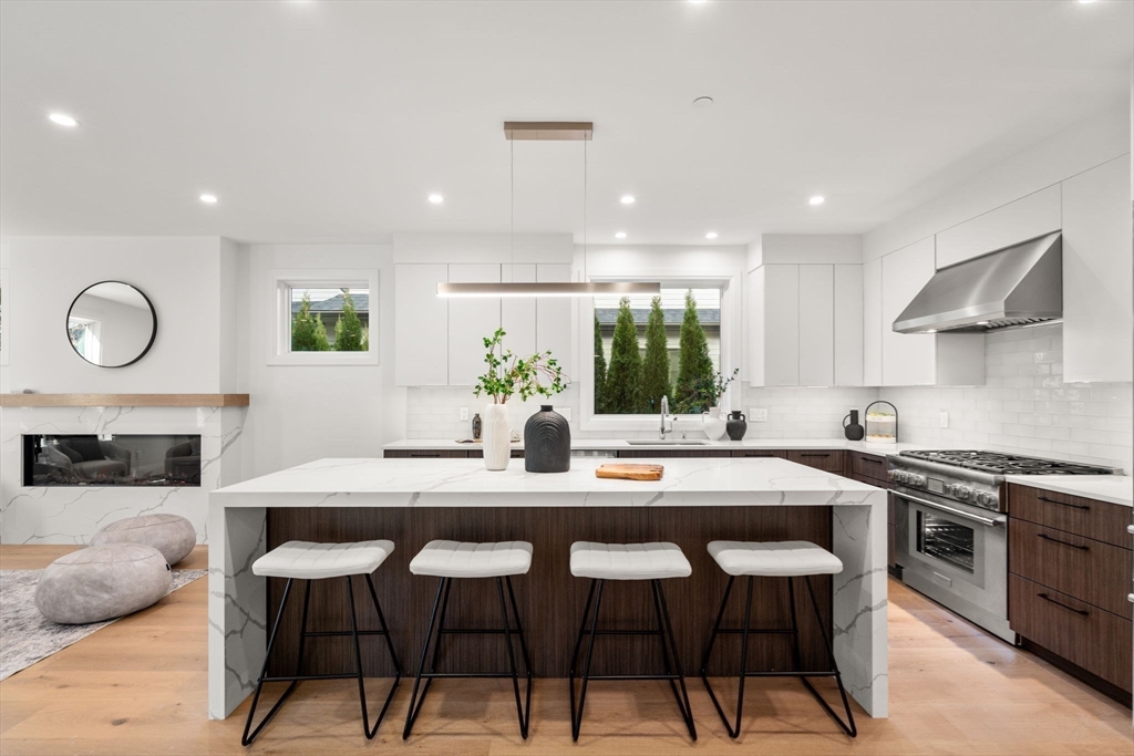 956 Walnut Street, Unit 5 Newton, MA 02459 - Photo 6 of 38 a kitchen with a table and chairs in it