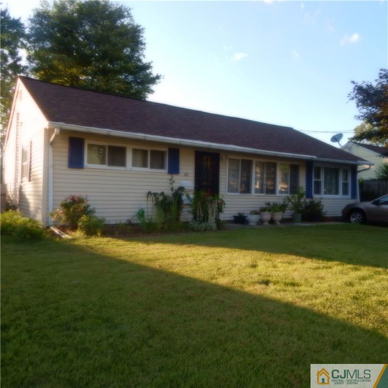 23 Idlewild Road Edison, NJ 08817 - Photo 1 of 19 a front view of a house with swimming pool having outdoor seating