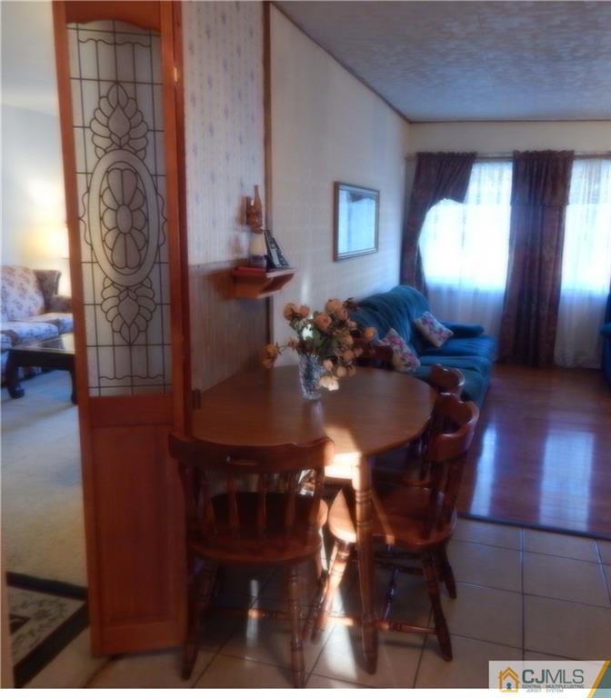 23 Idlewild Road Edison, NJ 08817 - Photo 11 of 19 a view of a dining room with furniture and wooden floor