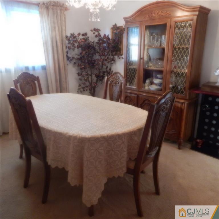 23 Idlewild Road Edison, NJ 08817 - Photo 12 of 19 a view of a dining room with furniture and wooden floor