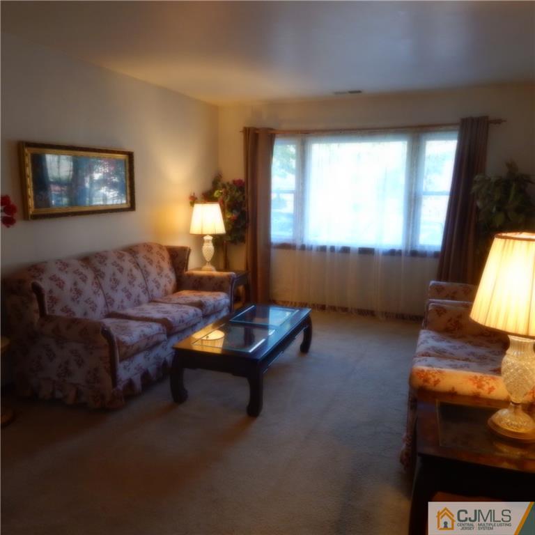 23 Idlewild Road Edison, NJ 08817 - Photo 13 of 19 a living room with furniture and a window