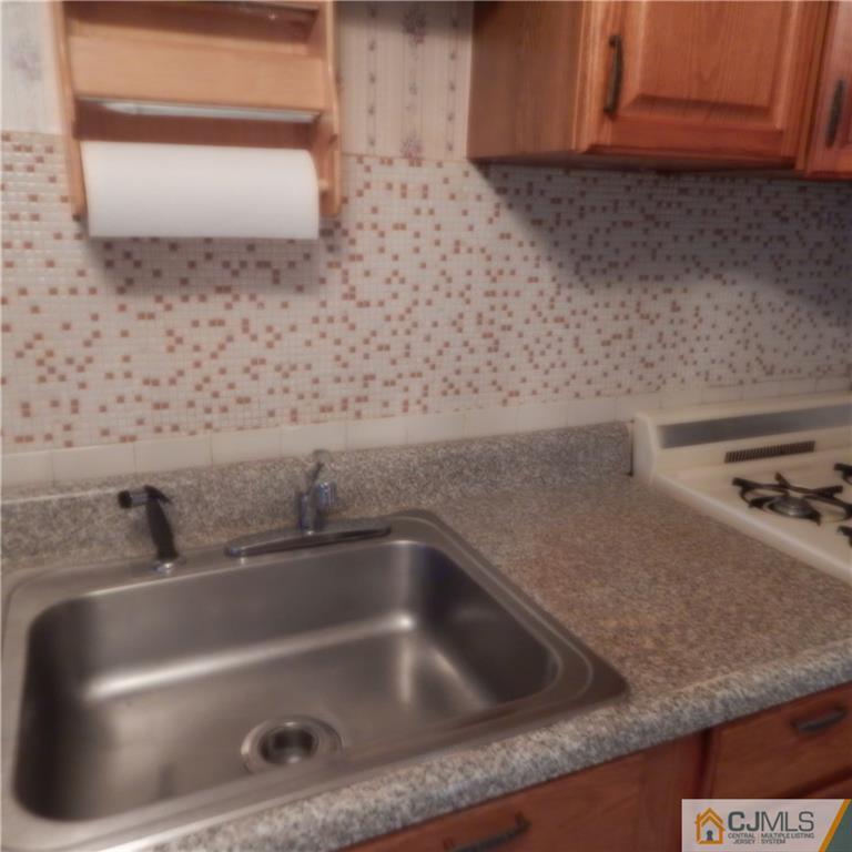 23 Idlewild Road Edison, NJ 08817 - Photo 16 of 19 a close view of sink and tap