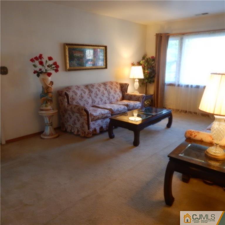 23 Idlewild Road Edison, NJ 08817 - Photo 17 of 19 a living room with furniture and wooden floor