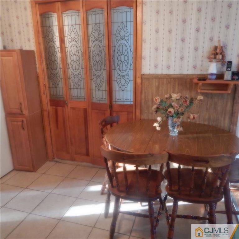 23 Idlewild Road Edison, NJ 08817 - Photo 10 of 19 a view of a dining room with furniture and chandelier