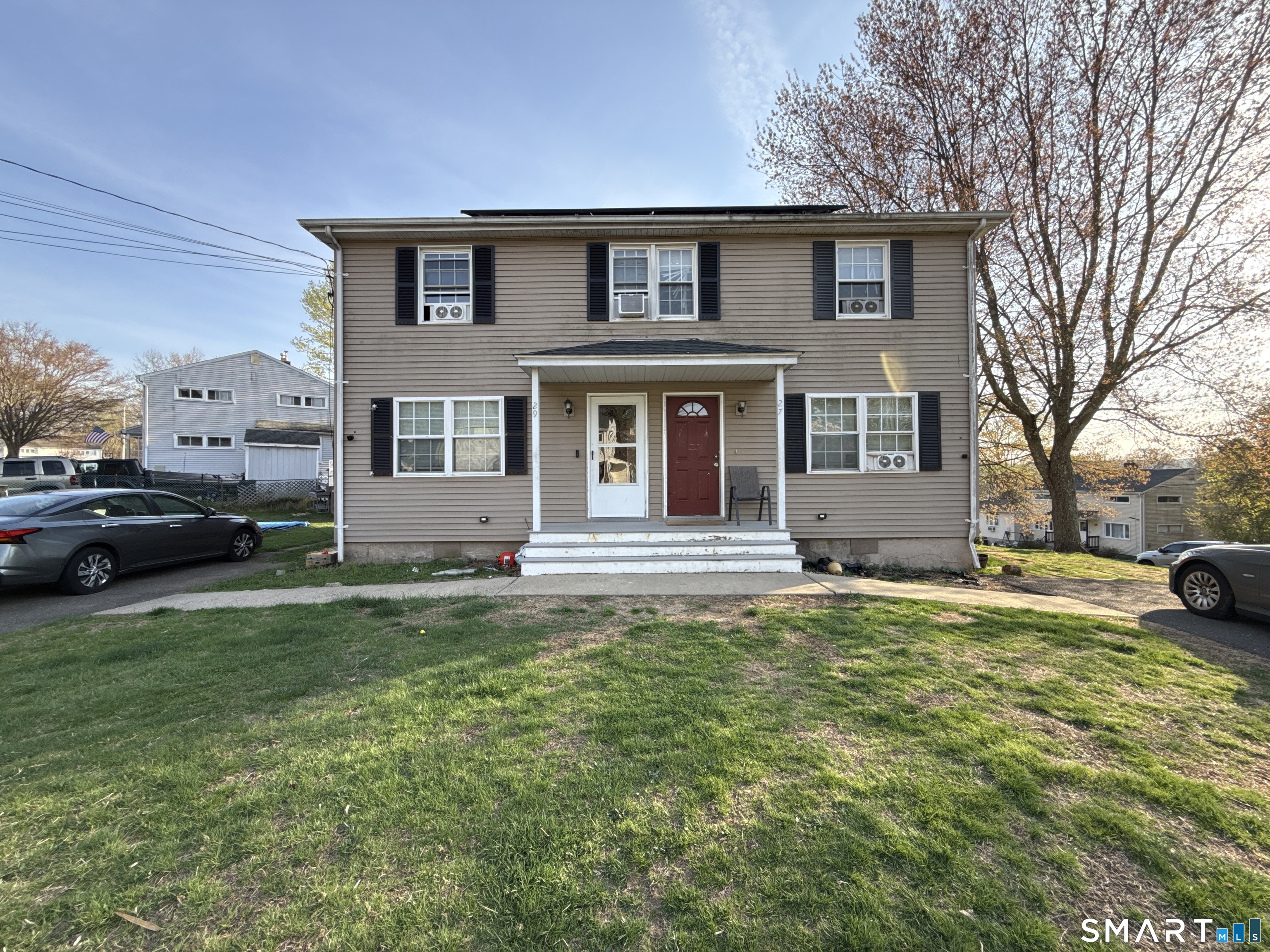 27-29 McLaughlin Terrace Derby, CT 06418 - Photo 1 of 16 a view of a house with a patio