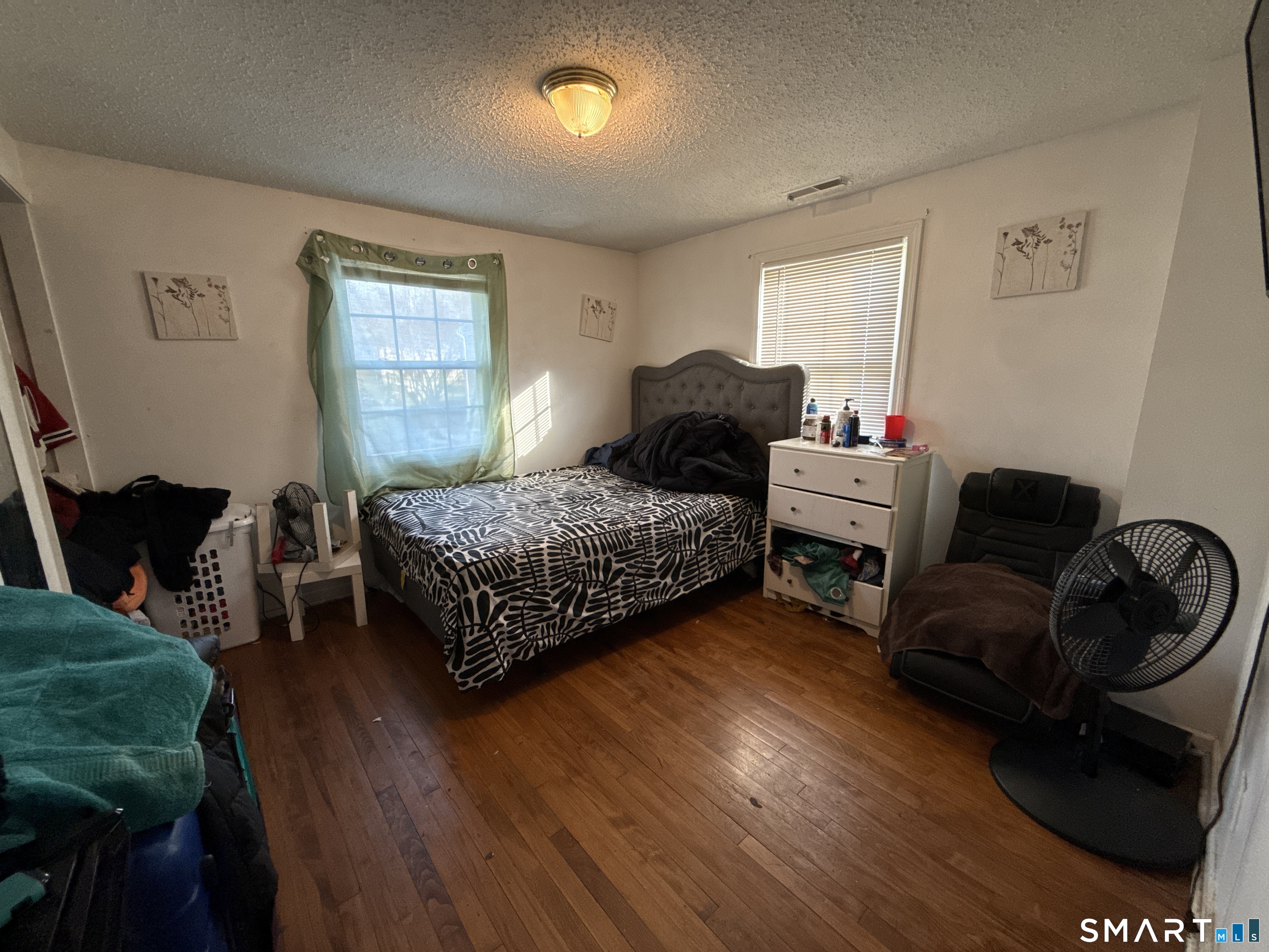 27-29 McLaughlin Terrace Derby, CT 06418 - Photo 11 of 16 a bedroom with bed and a window
