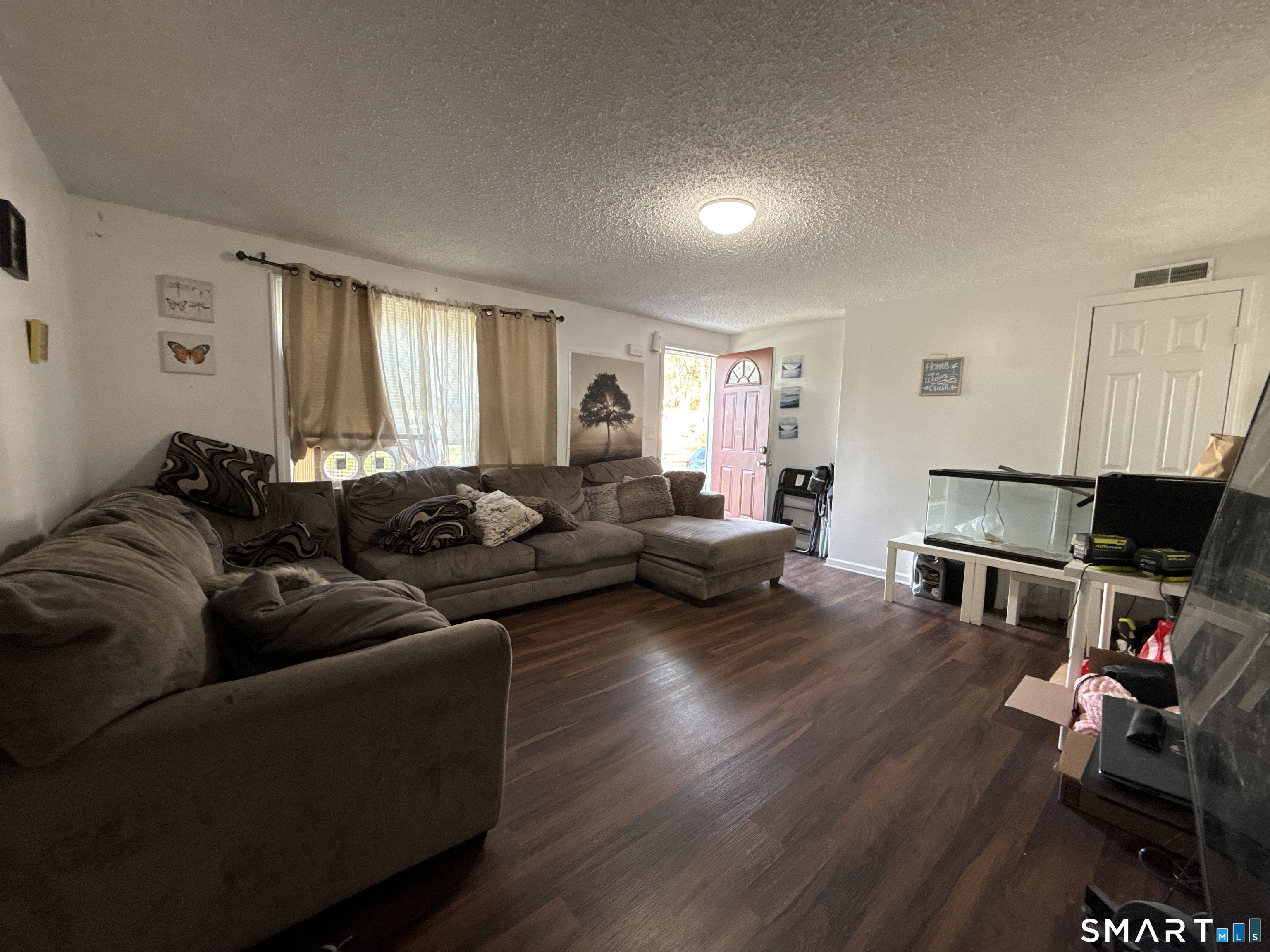 27-29 McLaughlin Terrace Derby, CT 06418 - Photo 13 of 16 a living room with furniture window and wooden floor