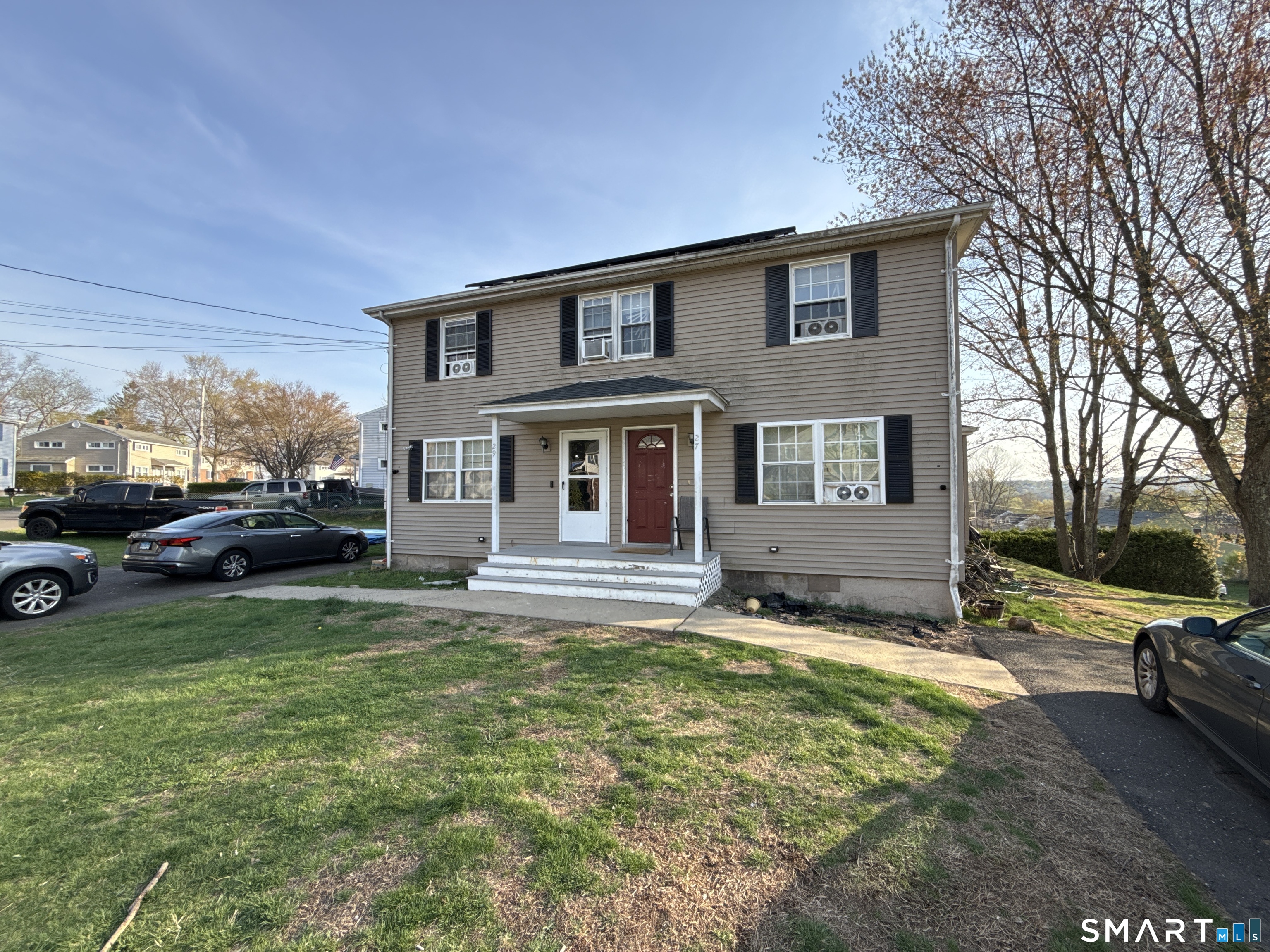 27-29 McLaughlin Terrace Derby, CT 06418 - Photo 2 of 16 a view of a house with a patio