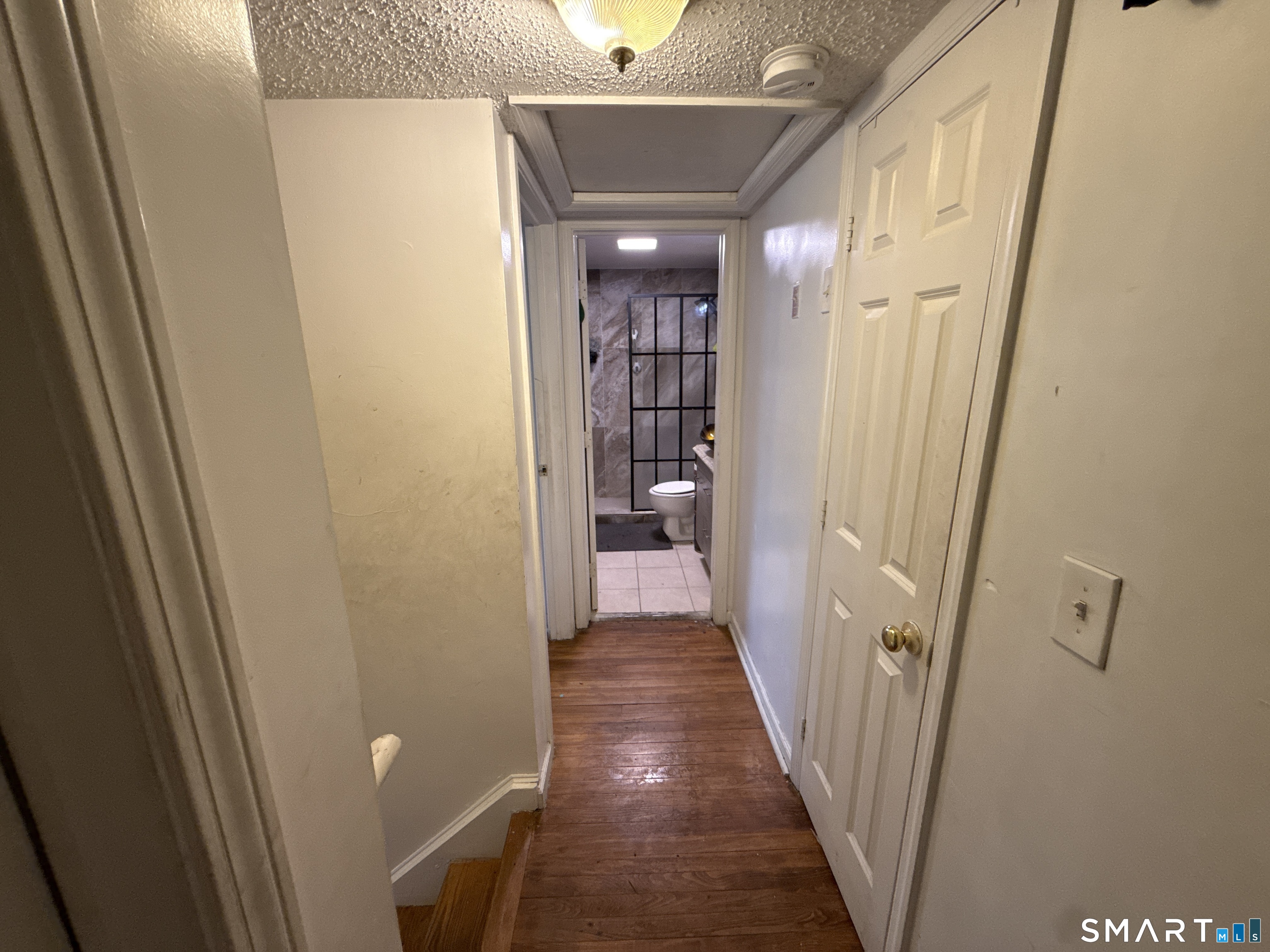 27-29 McLaughlin Terrace Derby, CT 06418 - Photo 7 of 16 a view of a hallway with wooden floor