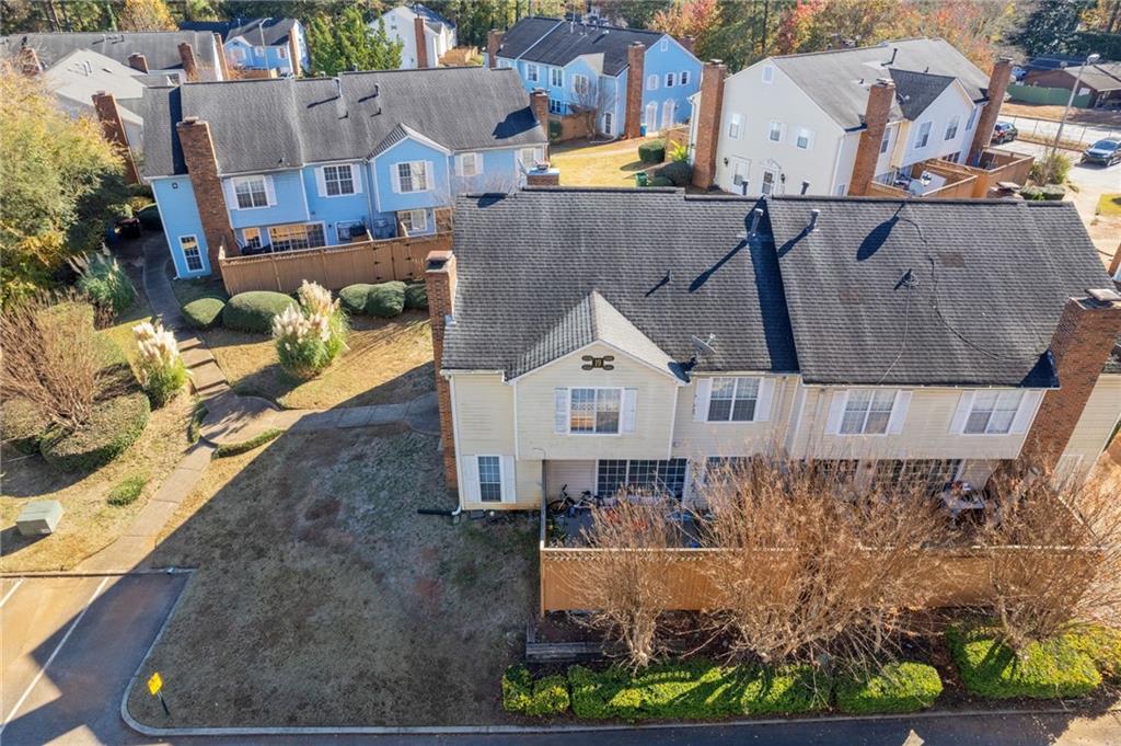 5554 Clover Rise Lane, Unit 2 Norcross, GA 30093 - Photo 11 of 18 an aerial view of a house with a yard and large tree