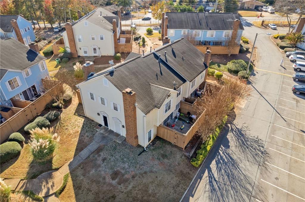 5554 Clover Rise Lane, Unit 2 Norcross, GA 30093 - Photo 12 of 18 an aerial view of a house with a yard