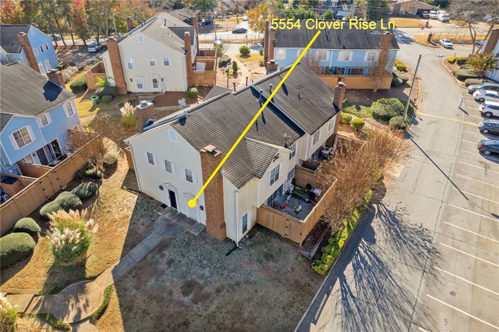 5554 Clover Rise Lane, Unit 2 Norcross, GA 30093 - Photo 13 of 18 an aerial view of a house with a yard