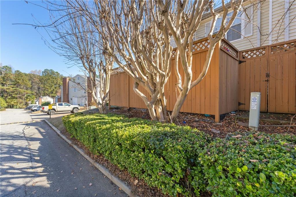 5554 Clover Rise Lane, Unit 2 Norcross, GA 30093 - Photo 4 of 18 a view of a backyard with large trees