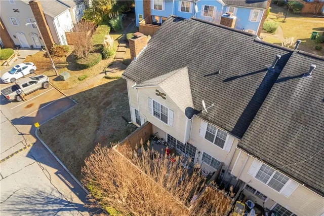 an aerial view of residential houses with outdoor space